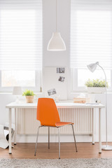 Desk with orange chair