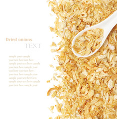 Dried chopped onion in a white ceramic spoon