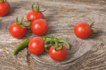 ripe tomatoes on wood background