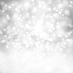 Bright shiny silver color abstract bokeh circle and sparkle shapes with white copy space background. Beautiful New Year and Christmas Holiday bokeh illustration copy space background.