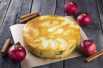 Apple biscuit pie on a dark wooden background
