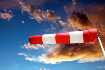 Windsock and stormy clouds