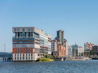 Modern social housing apartment building Silodam alongside IJ canal in Amsterdam, Netherlands