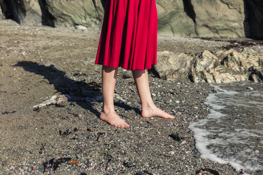 Feet of woman walking on the beach