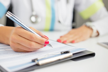 Doctor signing documents