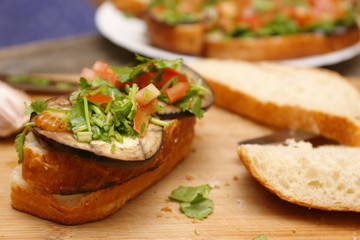 Bruschetta with grilled eggplant and vegetables on ciabatta
