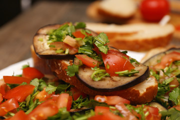 Bruschetta with grilled eggplant and vegetables on ciabatta