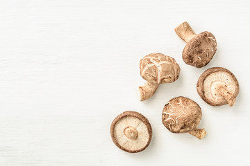 Overhead view of mushrooms on wooden background