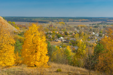 Naklejka premium Autumnal landscape with view on Chervlene village from nearest hill, sumskaya oblast, Ukraine