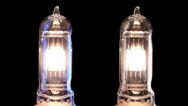 Halogen lamp. Real light bulb flickering. Tungsten filament of electric bulb. Loop.