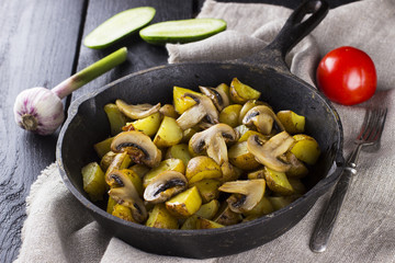 The Russian traditional food - frying pan with fried potato and