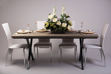 Wooden table setting and decoration for meal time, studio shot