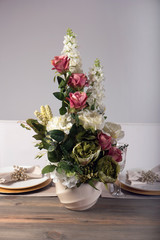 Wooden table setting and decoration for meal time, studio shot
