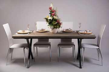 Wooden table setting and decoration for meal time, studio shot