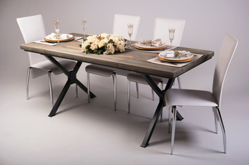 Wooden table setting and decoration for meal time, studio shot