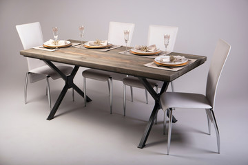 Wooden table setting and decoration for meal time, studio shot