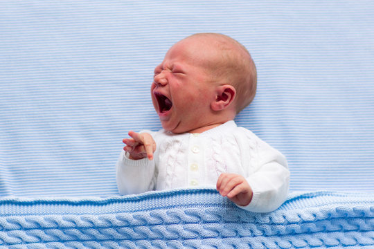 Newborn Baby Boy On A Blue Blanket