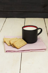 Home cookies with a milk cup