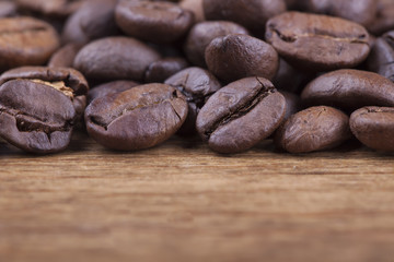 coffee grains on grunge wooden background