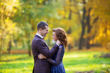 loving couple in love in the park looking at each other