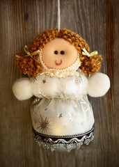 Christmas doll ornament on wood background