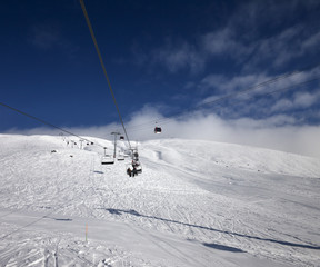Fototapeta na wymiar Gondola and chair lift at ski resort in nice day