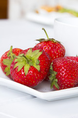 strawberries on a white plate