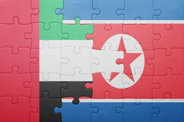 puzzle with the national flag of north korea and united arab emirates