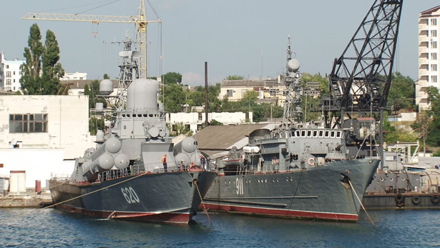 military ships at the quay wall