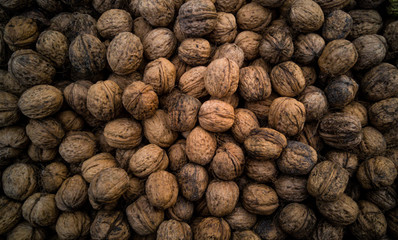 background of closeup view of walnut pile