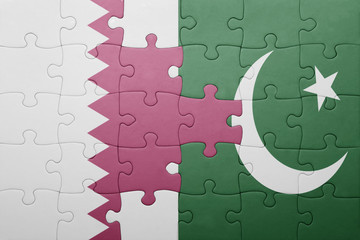 puzzle with the national flag of pakistan and qatar