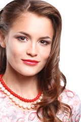 Portrait of young beautiful brunette woman in beads