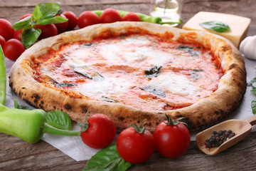 Delicious pizza on wooden table, closeup