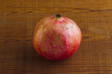 Pomegranate on a wooden background