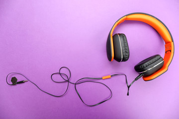 Headphones on purple background