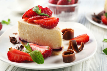 Delicious cheesecake with berries on table close up