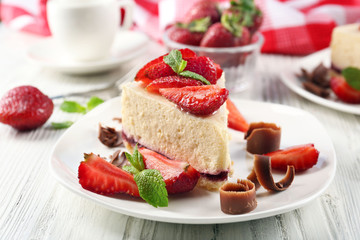 Delicious cheesecake with berries on table close up