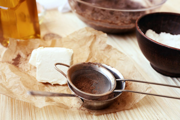Preparing dough for chocolate pie on table close up