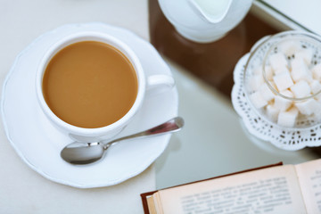 Cup of coffee on table close up