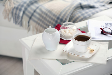 Cup of tea on table in living room