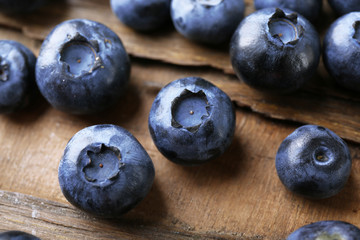 Fresh blueberries on wooden table, closeup