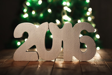 number 2016 on wooden table background, new year template