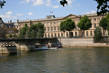 Fototapeta na wymiar Paris, Louvre and Academy Bridge from across the Seine