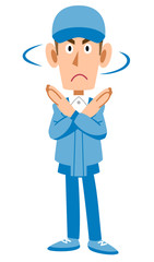 拒否の仕草を示す作業着の男性