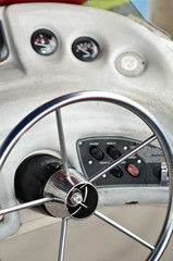 Closeup of rudder and chair in a luxury boat in black and white...