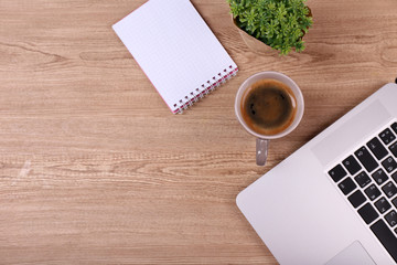 Top view of comfortable working place on wooden background
