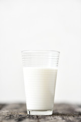 Fresh milk on wood plate