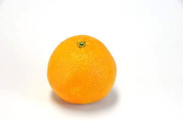 single fresh tangerine on white background