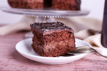 Served table with chocolate cake on wooden background