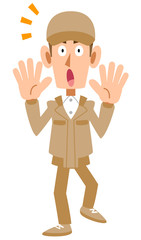 驚く作業着の男性